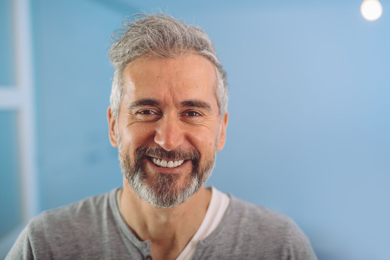 Smiling patient after successful tooth removal